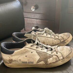 Golden Goose Distressed White and Black Star Sneakers